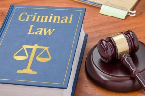 A law book with a gavel - Criminal law