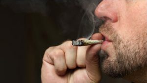 man smoking marijuana