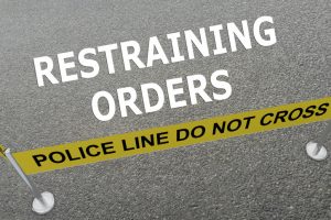 illustration of Restraining Orders title on the ground in a police arena